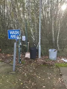 Wash area at a FedEx depot before installation of a Nilfisk 400HS DTE system. Existing setup prior to full pressure washer install and site modifications.